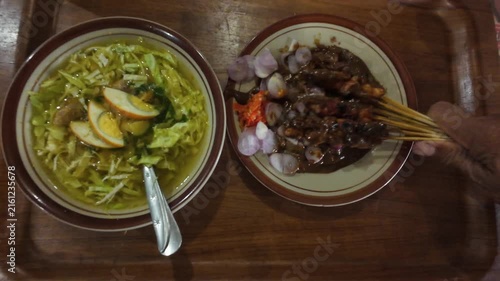 Traditional Indonesian Soto Ayam Soup with Cabbage Egg and Chicken Satay Sate with Peanut Sauce