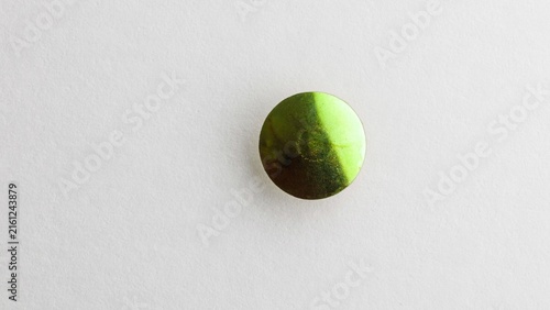 green tennis ball on the net