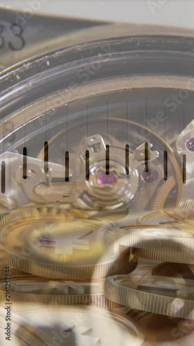 Financial data processing over close up of a watch and yen gold coins against grey background