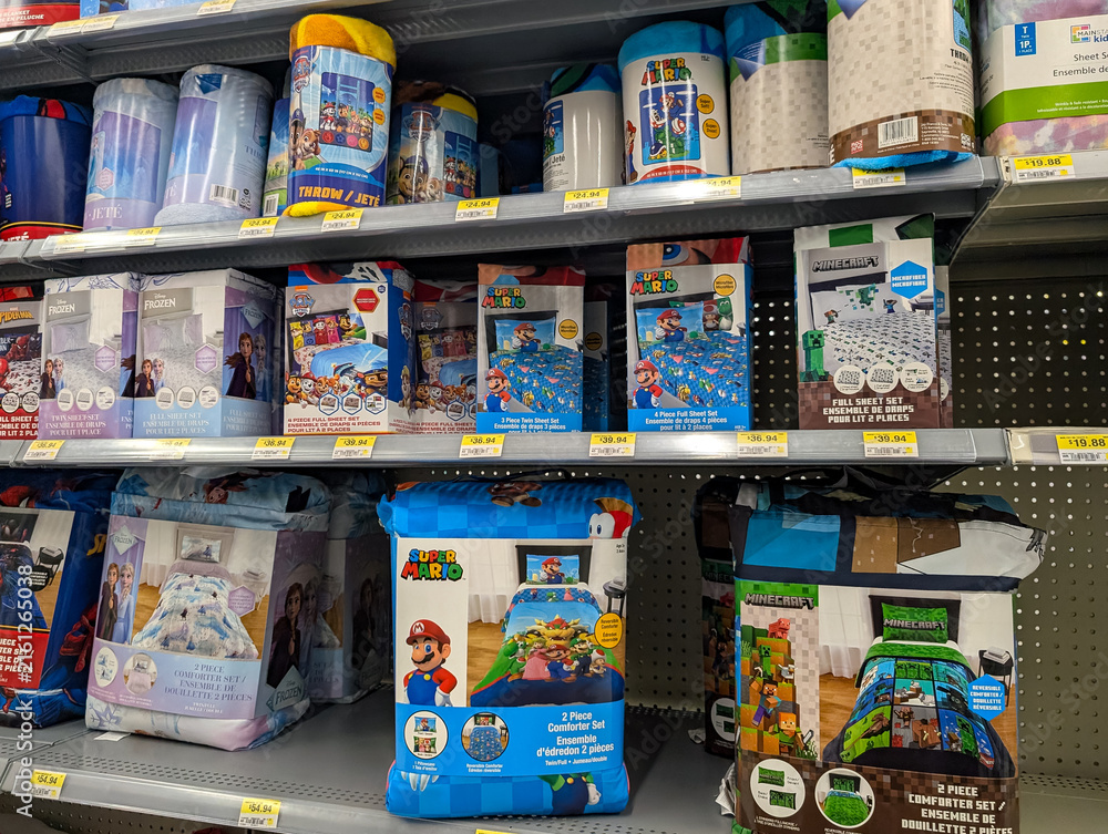 Fototapeta premium Gaspesie, Quebec, 06 June 2026 : Children's bedding sets and throws featuring popular characters are displayed on retail store shelves.