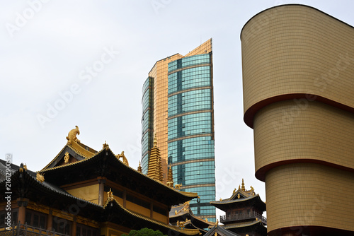 Photography Ancient chinese temple against a modern skyscraper