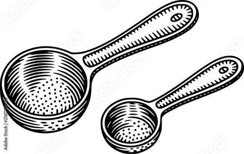 Vintage of two measuring spoons with perforated bowls