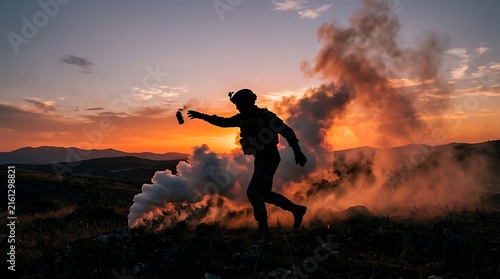 Silhouette of a person running through a smoky landscape during sunset with clouds and mountains in the background