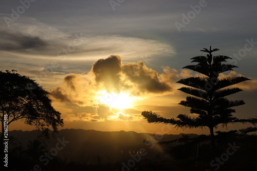 Dramatic Golden Sunset Over Mountains with Silhouette