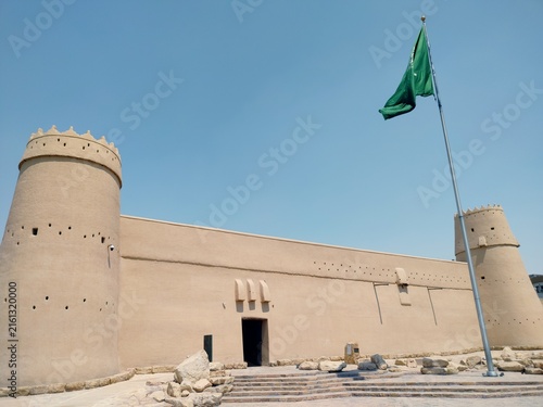 Canvastavla Al Masmak Fortress historic mudbrick fort exterior with Saudi Arabian national f