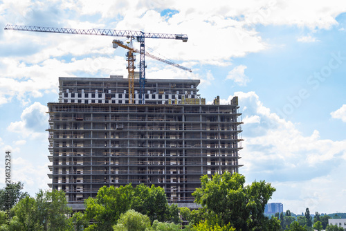 Construction of two high-rise buildings and two construction cranes.