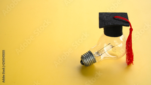 Graduation Cap Resting on Top of Light Bulb Concept of Creative Higher Education Smart Thinking and Innovative Learning