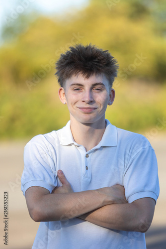 Portrait of a 17 year old boy in a white shirt and jeans