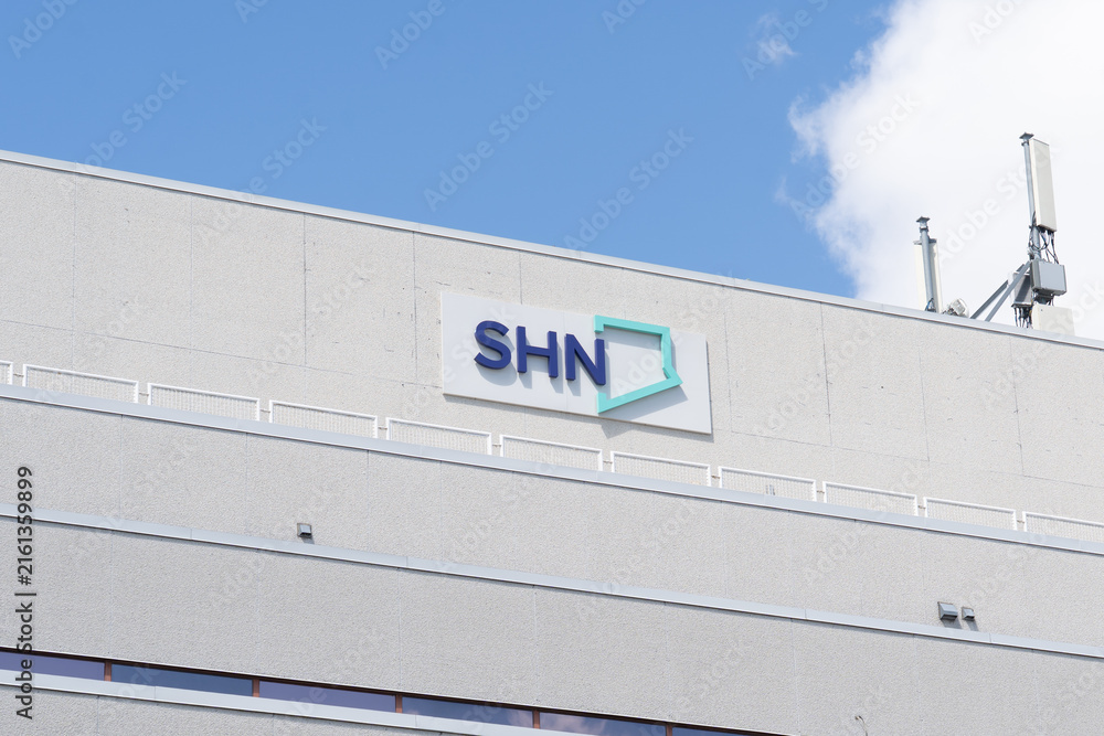 Fototapeta premium Toronto, ON, Canada - August 17, 2026: The Scarborough Health Network (SHN) sign on the building in Scarborough, Toronto, ON, Canada. SHN is a major hospital network serving Scarborough in Toronto. 