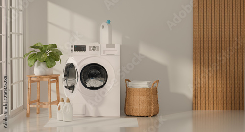 Modern laundry room interior with washing machine, detergent bottles, folded towels, and wooden furniture in bright sunlight. 3D rendering.