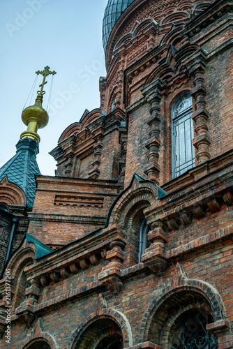 Картината върху платно Upper brick towers and green onion domes of historic Saint Sophia Cathedral in H