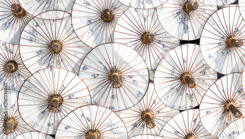 Japanese and Chinese umbrellas pattern background. White and blue traditional paper parasol. Oriental ornament with sakura, flowers, cranes, wave and dragon. Decorative handmade Asian shades. Top view