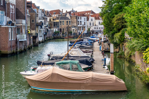 This image shows an idyllic canal in Dordrecht, often referred to as the Venice of the Netherlands because of the historic warehouses directly on the water