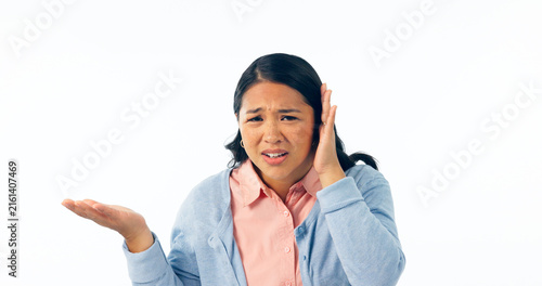Confused, portrait and deaf woman with hand on ear in studio for speak up, volume or huh on white background. Doubt, face or Asian model with hearing loss, problem or frustrated by communication fail
