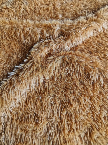 Fotografía Close-up texture of soft light brown plush faux fur fabric, detailed macro background for design projects