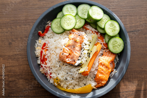 Close-up of a healthy salmon fillet served with rice and steamed vegetables