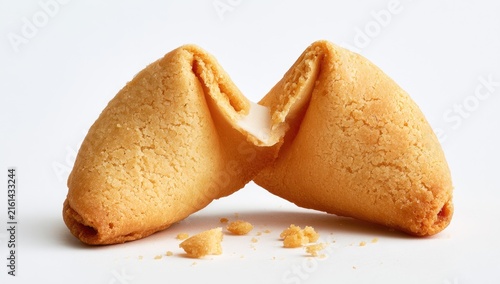 Tapety artystyczne A Delicious Fortune Cookie Broken in Half on a White Background.
