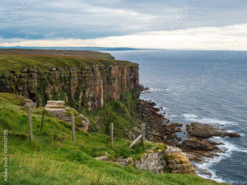 Картината върху платно Dunnet Head, Caithness, on the north coast of the Scottish Highlands, a rugged sandstone rock peninsula overlooking Pentland Firth, is the most northerly point of the British mainland