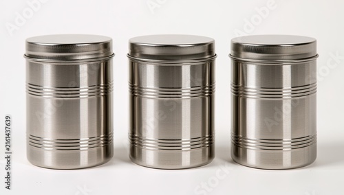 Three identical stainless steel canisters with horizontal lines arranged in a row.