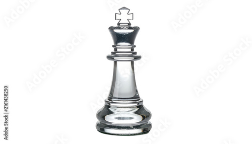 A single, clear glass king chess piece stands centered against a dark void. isolated on white background