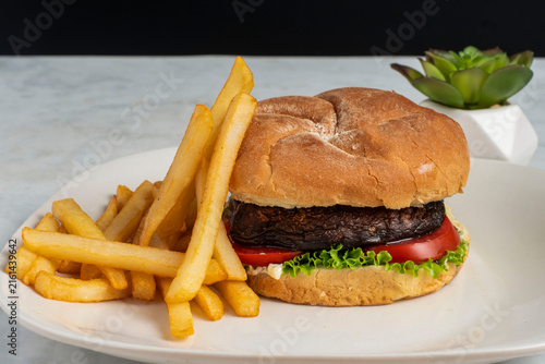 mushroom burger  with a side of fries