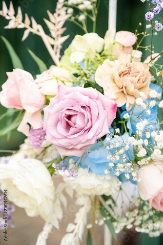 Beautiful Floral Decoration at an Outdoor Wedding Ceremony, Elegant Wedding Flowers and Arch Setup in Natural Sunlight