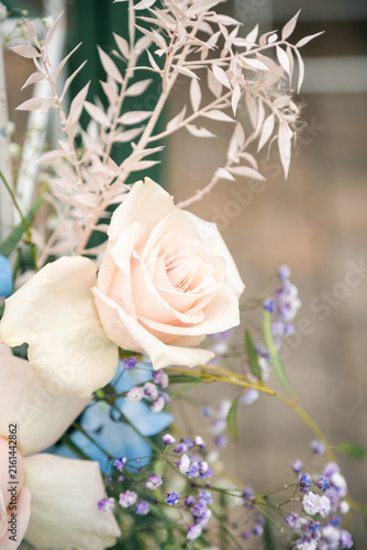 Beautiful Floral Decoration at an Outdoor Wedding Ceremony, Elegant Wedding Flowers and Arch Setup in Natural Sunlight