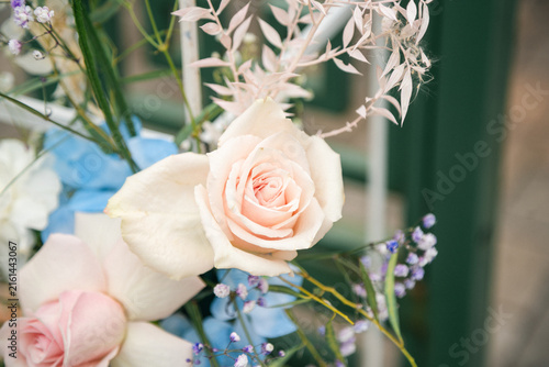 Beautiful Floral Decoration at an Outdoor Wedding Ceremony, Elegant Wedding Flowers and Arch Setup in Natural Sunlight