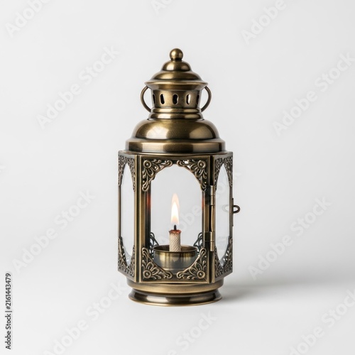 Antique Brass Lantern with Burning Candle Inside.