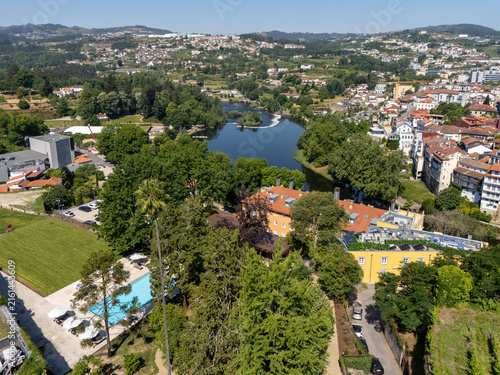 Obraz na plátně Aerial view of Casa da Calcada garden pool and Tamega River weir in Amarante
