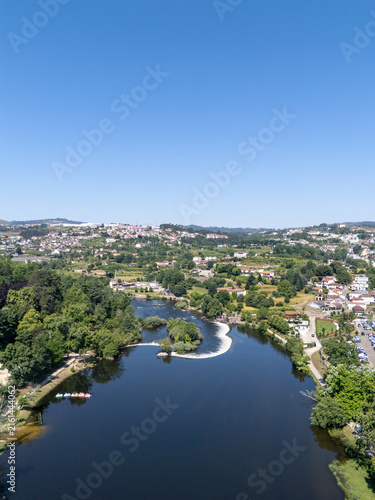 Obraz na płótnie Aerial vertical view of Tamega River dam weir and park in Amarante Portugal
