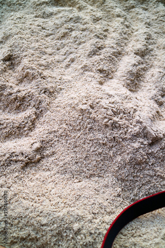 Obraz na plátně Fine sand rice bran form a textured, earthy surface