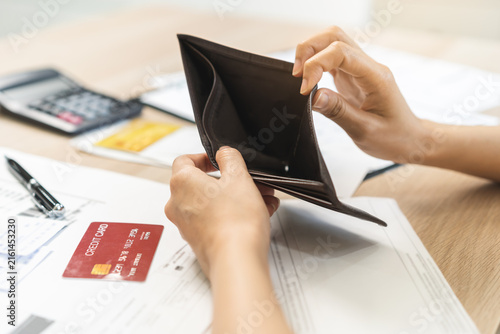 Konstfotografi Debt financial concept, stressed problem asian woman hand open empty wallet, purse not have budget of money to pay no have credit card, not able payment bill, loan or expense with bank, bankruptcy