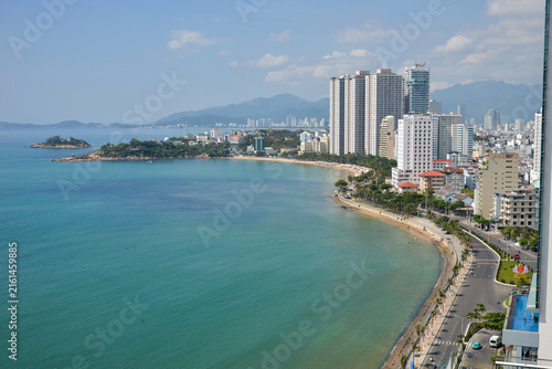 NHA TRANG, VIETNAM – MAY 10, 2026: Aerial view of North Nha Trang coastline with Nha Trang Bay, beachfront road, buildings and mountains.