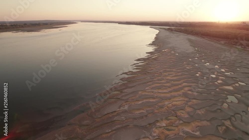 Aerial panorama of the Danube at sunset with shallow water and newly exposed sand islands