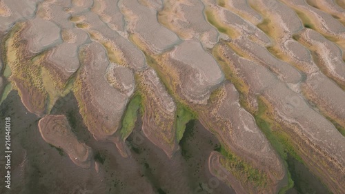 Aerial view of abstract sand patterns and flowing Danube River during low river levels	and drought
