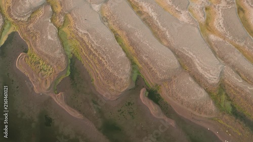 Abstract patterns of the exposed Danube riverbed during extremely low water in summer. Ephemeral sand patterns resembling desert dunes
