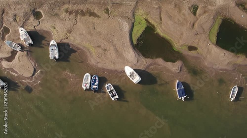 Aerial view of stranded boats on newly exposed Danube riverbank during severe low water