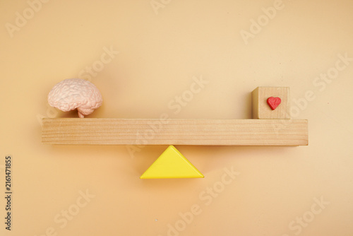 Canvastavla Brain and heart balance concept on wooden seesaw, representing logic versus emotion, emotional intelligence, decision making, psychology and mental balance
