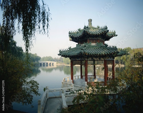 Traditional Chinese waterside pavilion on lake, Diaoyutai in Beijing