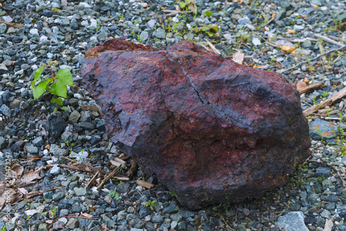 Rusty Rock Rests on Gravel