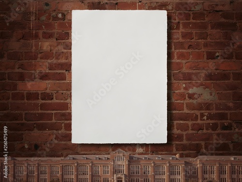Blank white canvas on rustic brick wall with architectural model