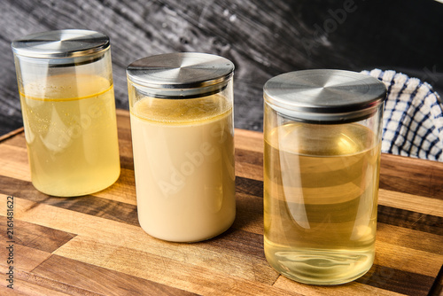 Storing three types of homemade cooking stock in jars, chintan, tonkotsu and dashi
