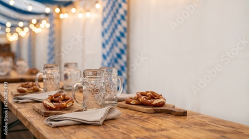 Close Up of Oktoberfest Table Setting with Beer Steins and Bavarian Table Decor