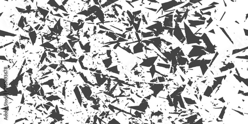 Фотография Abstract black shards scattered across a stark white background suggesting fragm