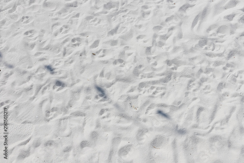 Fine white sand that glistens and reflects the sunlight.