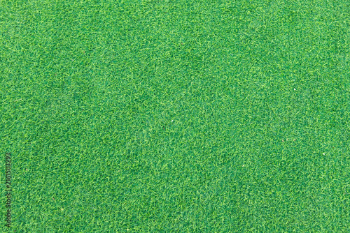 Close-up of lush green artificial grass, showcasing its detailed texture and vibrant color, perfect for outdoor landscaping and sports fields.