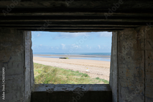 Принти на полотні View of Utah Beach from inside a German concrete bunker at resistance nest Wn 10 in Normandy, France, showcasing the WW2 Atlantic Wall