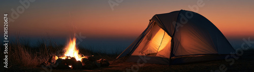 Campfire tent camping dusk sunset flame glow evening travel outdoor adventure night landscape horizon sky grass leisure tourism vacation relaxation peaceful scenic wilderness nature mountain hill