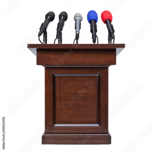 Cuadro en lienzo Professional wooden podium with five microphones, including two with colorful fo